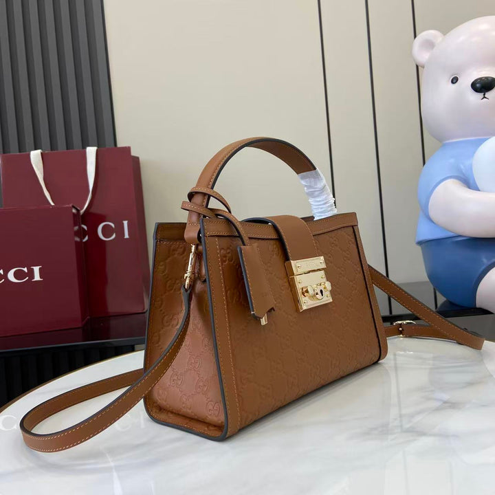 توب هاندل قوتشي بادلوك جلد طبيعي فخم